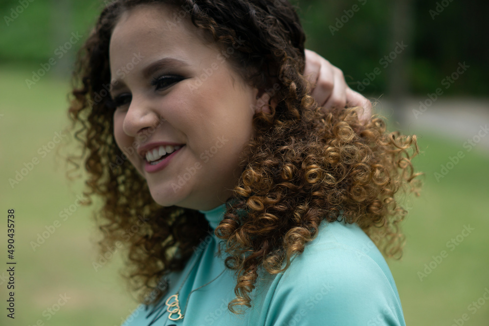 happy white curly haired teenager outdoors happy white curly haired teenager outdoors