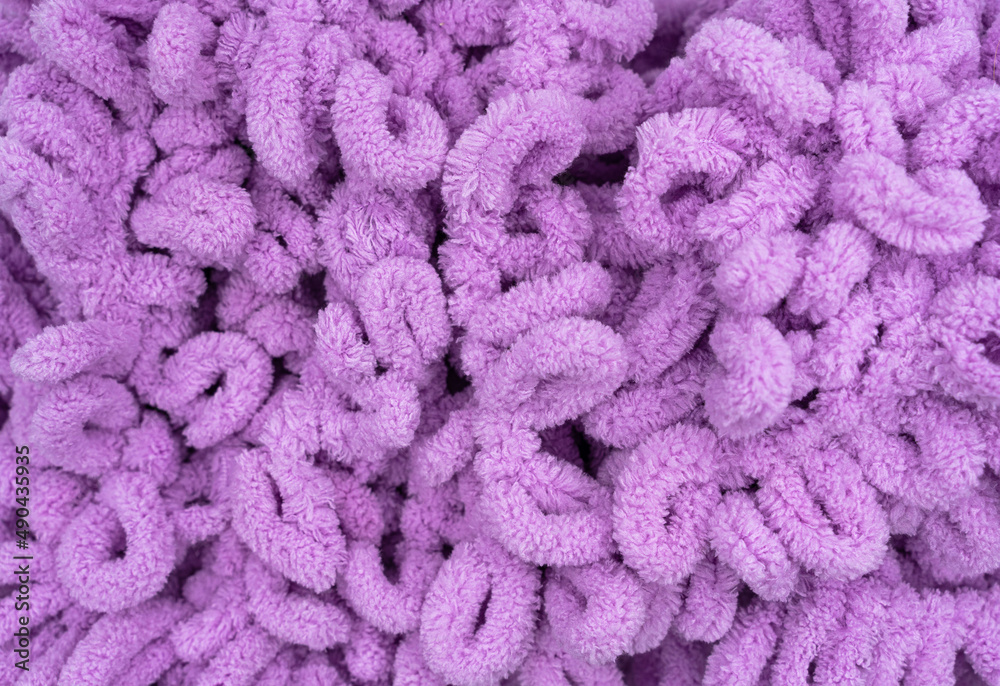 Soft yarn, delicate purple yarn. Hand knitting as a hobby.. High quality photo Soft yarn, delicate purple yarn. Hand knitting as a hobby.. High quality photo