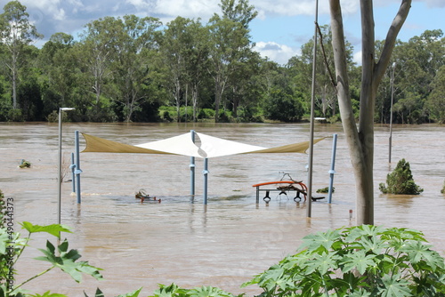 Partially submerged Buildingins in Receding Flooded Brisbane River at Colleges Crossing Recreation Park near Ipswich, Queensland Australia 1st March 2022. Worst Flooding in Decades, State of Emergency photo