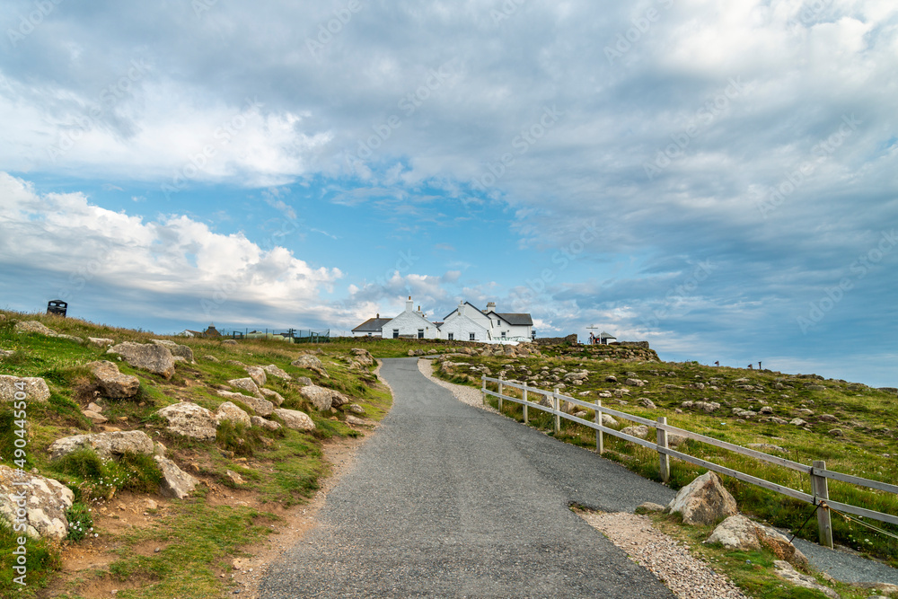 Land's End coastal pathway,looking south towards main tourist area,whitewashed buildings,Cornwall,Southwest England,UK. Land's End coastal pathway,looking south towards main tourist area,whitewashed buildings,Cornwall,Southwest England,UK.