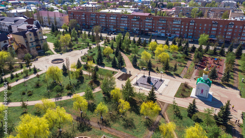 green park in the city center near residential buildings