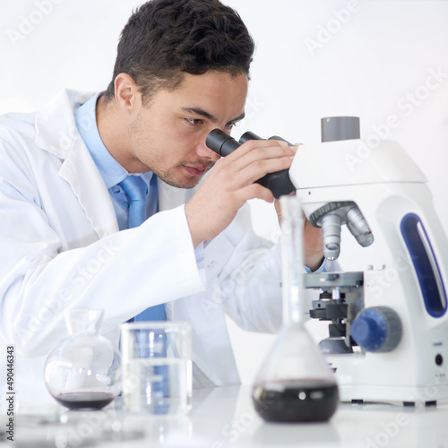 Identifying microorganisms that are causing infection. Cropped shot of a young male scientist working in his lab.
