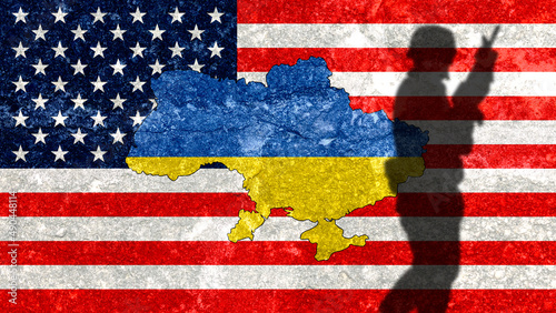 Ukraine map on a wall with the USA flag painted on it. Shadow of a soldier from Russia's war with Ukraine. War conflict between Russia and Ukraine. United States ally of Ukraine