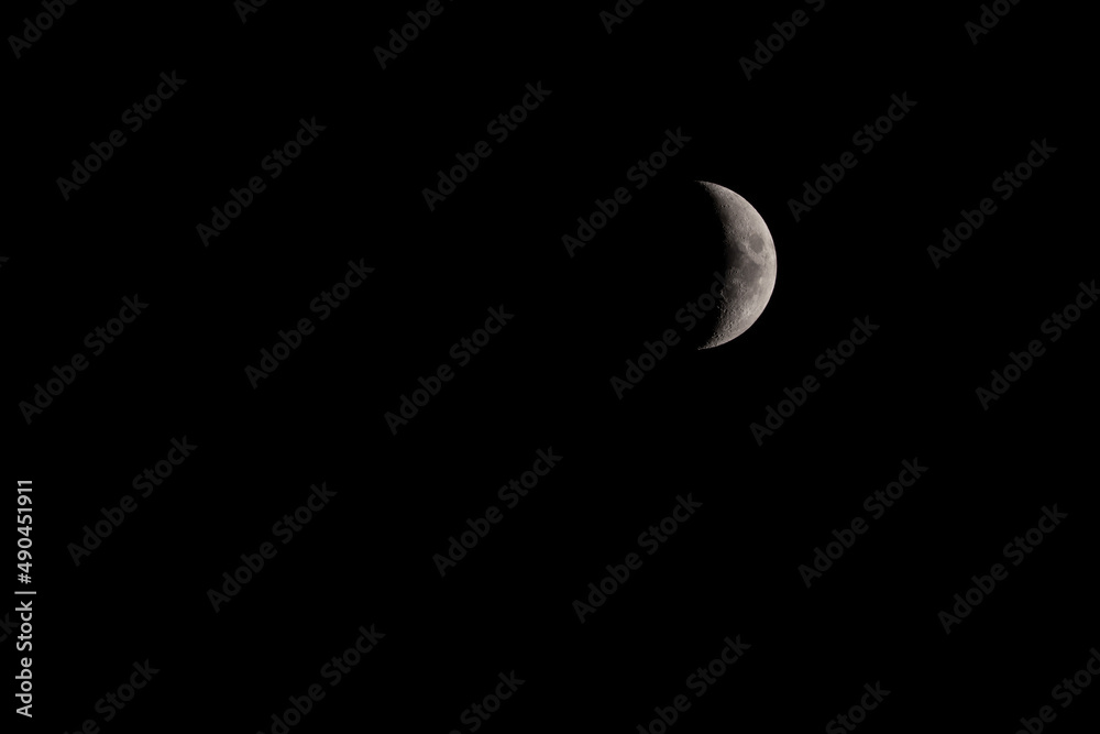 Crescent moon in the dark night sky Crescent moon in the dark night sky