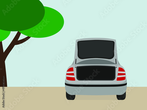 Car with open trunk standing outdoors