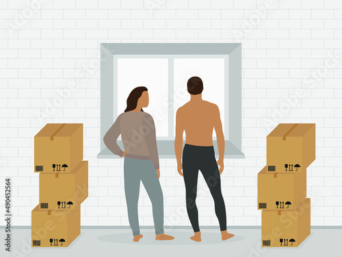 A female character and a male character in home clothes are standing near a window with cardboard boxes