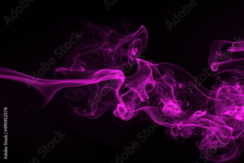 Purple smoke abstract on black background, darkness concept