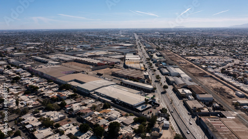 Daytime aerial view of factories and industry in the urban core of Mexicali, Baja California, USA.