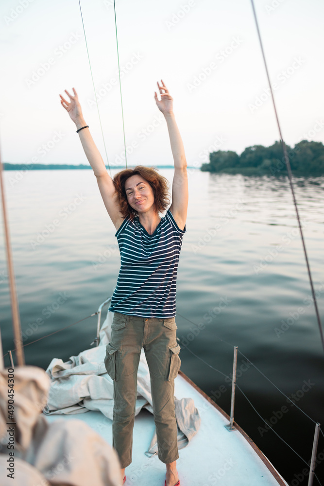Young woman having fun on a yacht