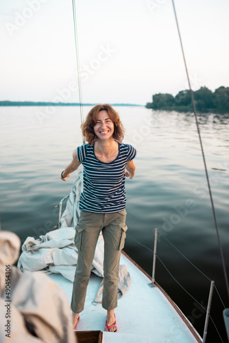Young woman having fun on a yacht