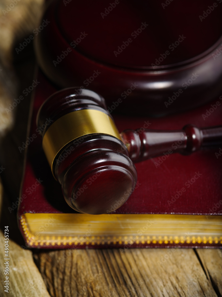 close-up of judge gavel and law books in court, concept of law and justice close-up of judge gavel and law books in court, concept of law and justice