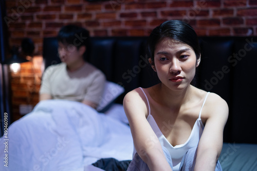 Young Asian wife upset because her husband doesn't want to make love