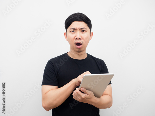 Man using tablet feeling amazed white background