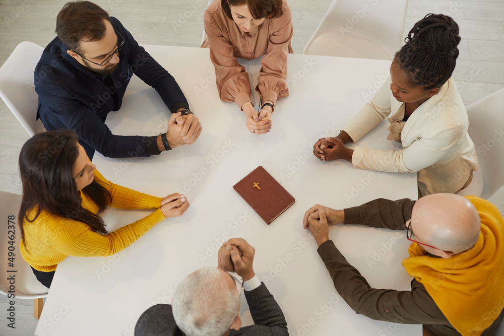 Diverse group of different thankful humble religious multiracial
