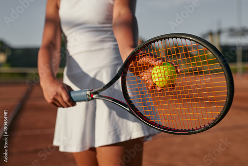 Crop black sportswoman with tennis racquet on court © kegfire