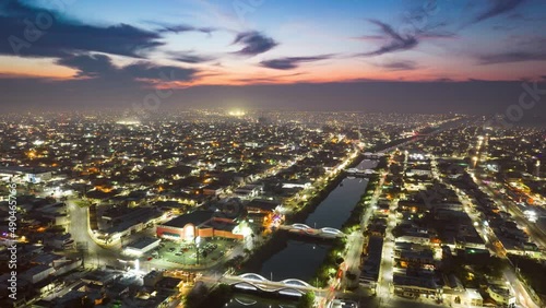Aerial time lapse - Night over Reynosa, Tamaulipas, Mexico, rising reverse shot photo