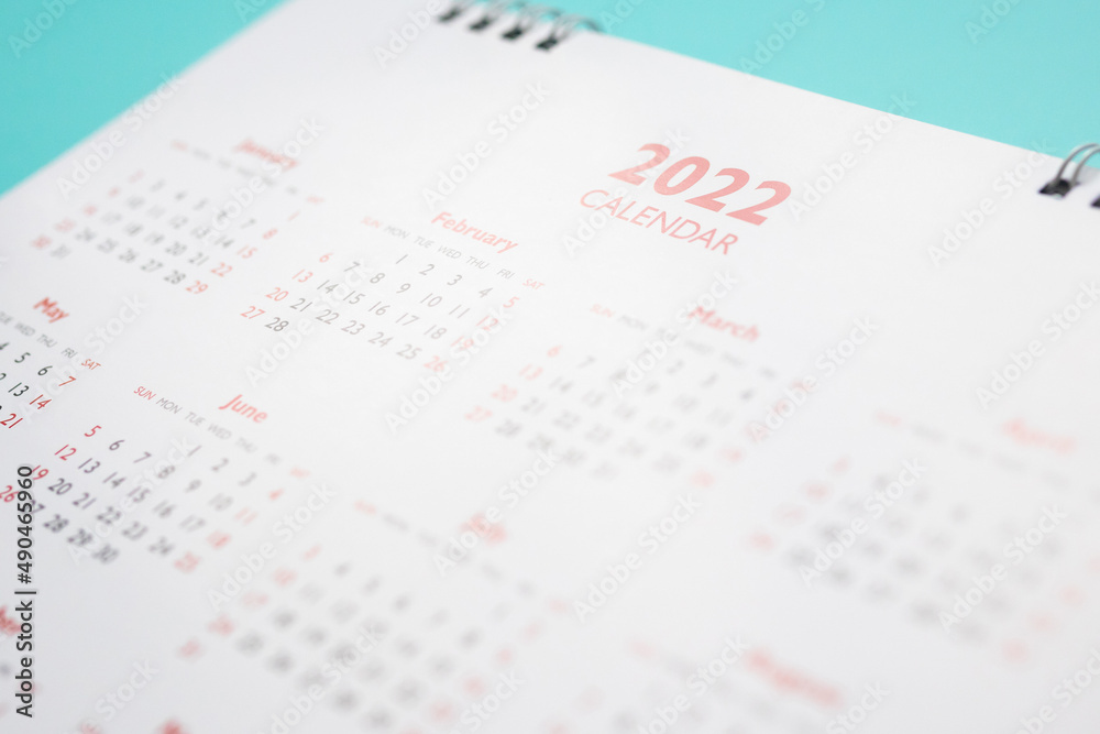 2022 calendar page on blue background business planning appointment meeting concept 2022 calendar page on blue background business planning appointment meeting concept