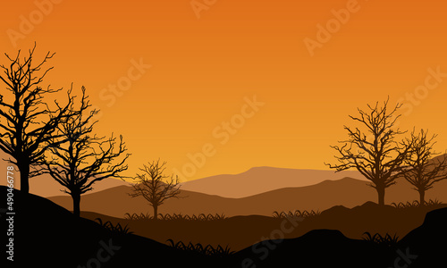 Mountain view with realistic dry tree silhouette from outside in the heat of the morning