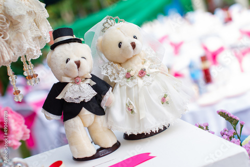 newlyweds teddy bear sitting on gift box