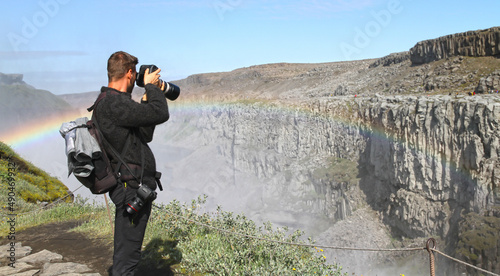 Tourists at Dettifoss. The waterfall is situated in Vatnajökull National Park in Northeast Iceland, and is reputed to be the most powerful waterfall in Europe photo