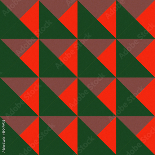 Seamless geometric pattern of red, green and burgundy triangles for textiles.