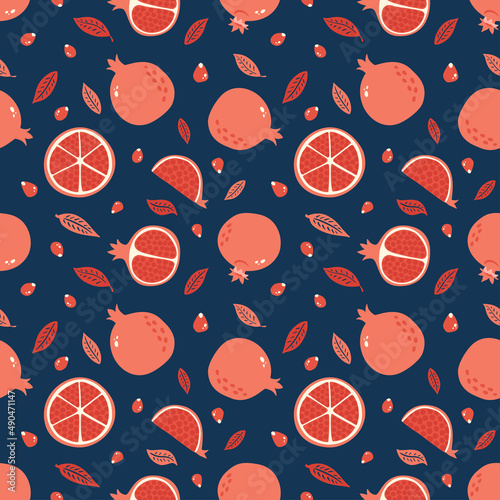 Pomegranate seamless pattern with seeds and leaves on blue background. Hand drawn Garnet ornament. Red tropical fruit texture for print, wallpaper cover, textile, juice package and interior design