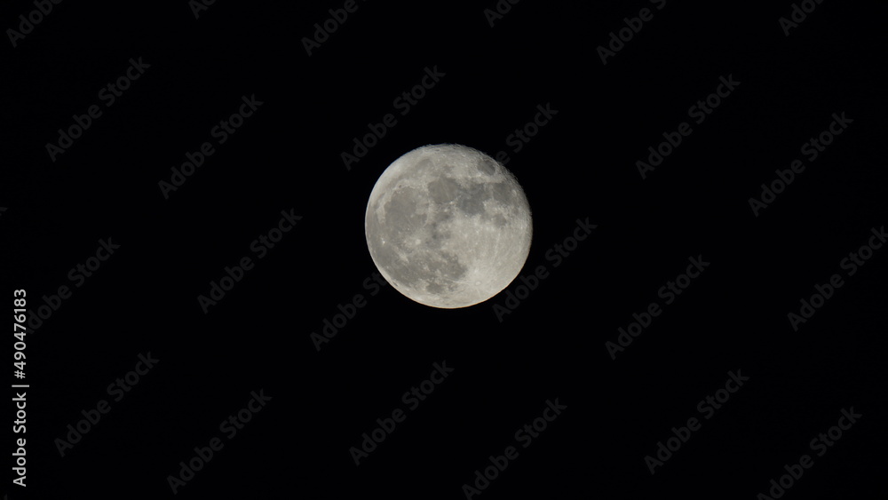 The moon view with the bright moonlight and moon surface at night The moon view with the bright moonlight and moon surface at night