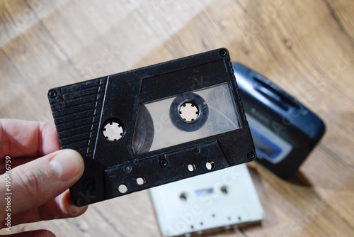 audio cassette in the hands of a man. Retro audio.