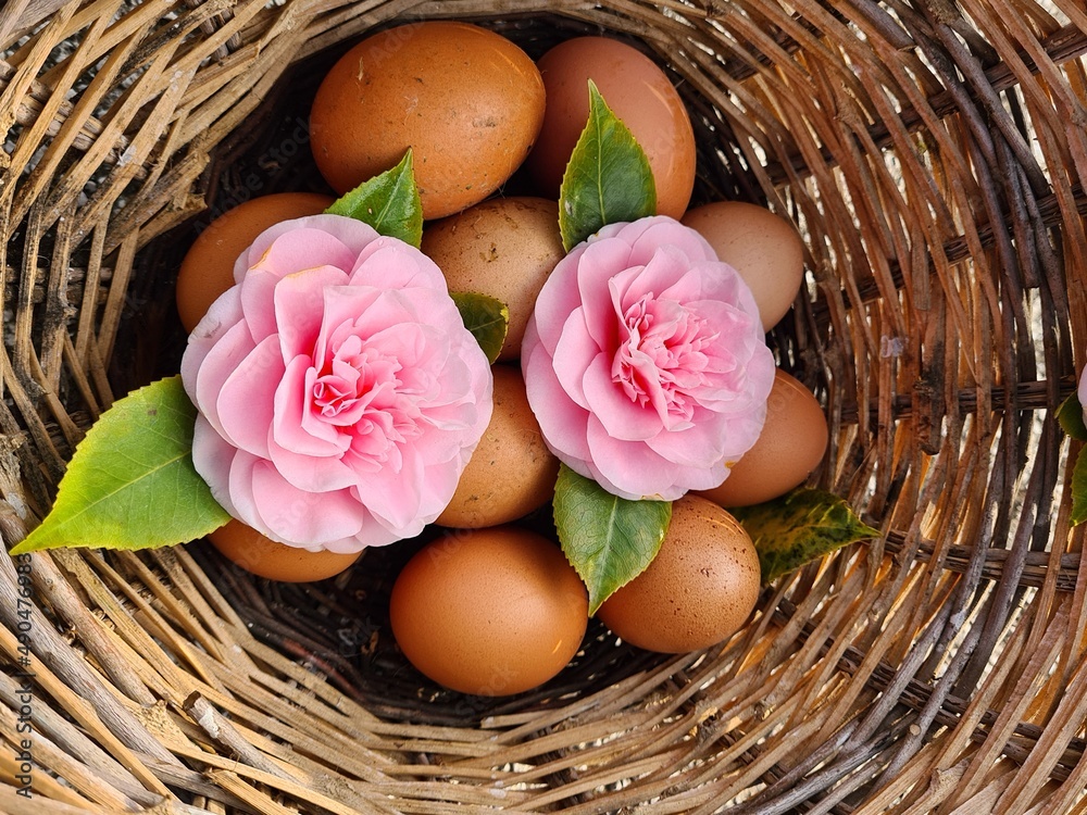 basket with flowers and eggs