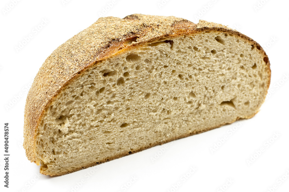 Half a delicious whole-grain bread on a white isolated background close-up. Texture of healthy bread.