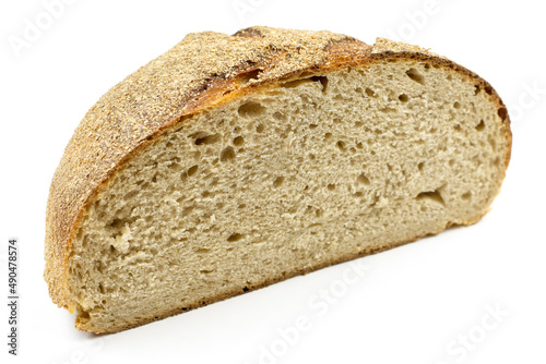 Half a delicious whole-grain bread on a white isolated background close-up. Texture of healthy bread.