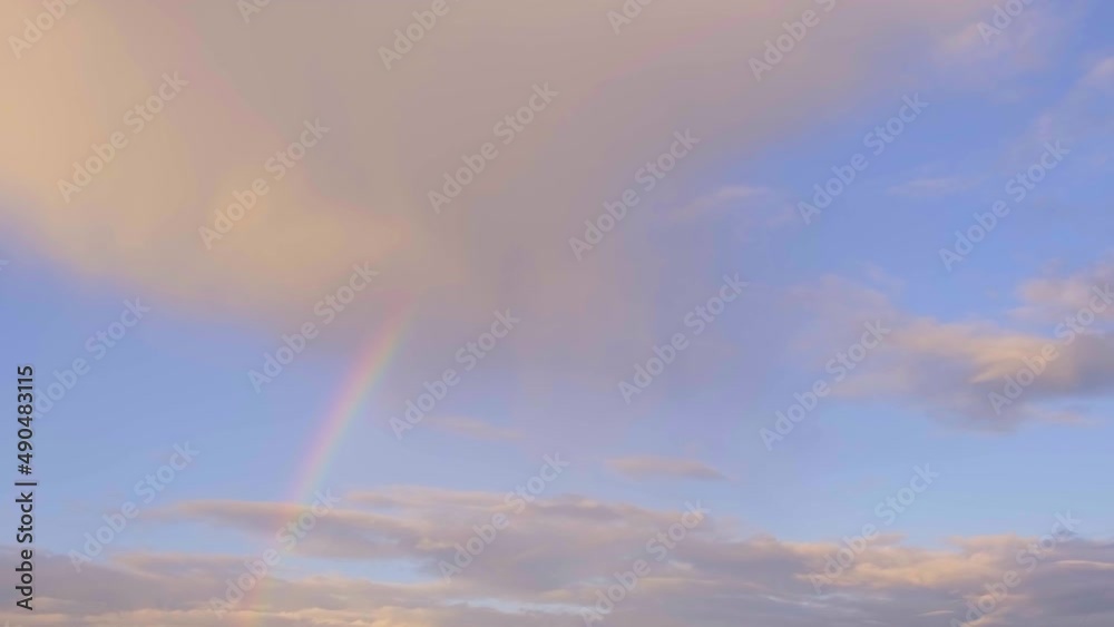 Multicolored rainbow and clouds in the sky after the rain, abstraction, blurred Multicolored rainbow and clouds in the sky after the rain, abstraction, blurred