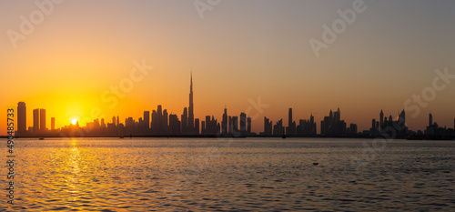 Photography Dubai Downtown skyline panorama during sunset seen from Dubai Creek Harbour promenade