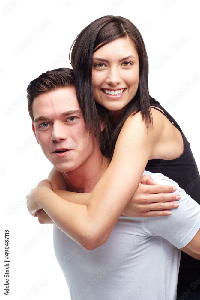 So happy together. A beautiful young woman being carried by her boyfriend while isolated on white. So happy together. A beautiful young woman being carried by her boyfriend while isolated on white.