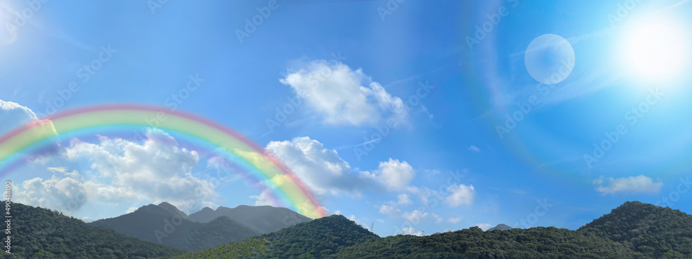 爽やかな空に浮かぶ雲と綺麗な虹 Stock Photo Adobe Stock