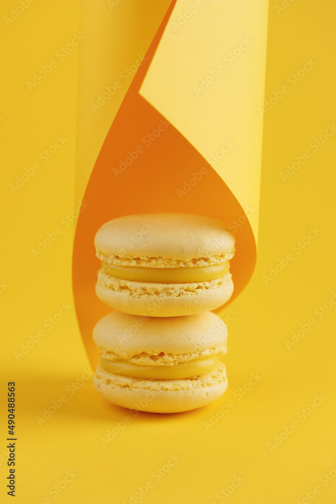Lemon macaroons on a yellow background