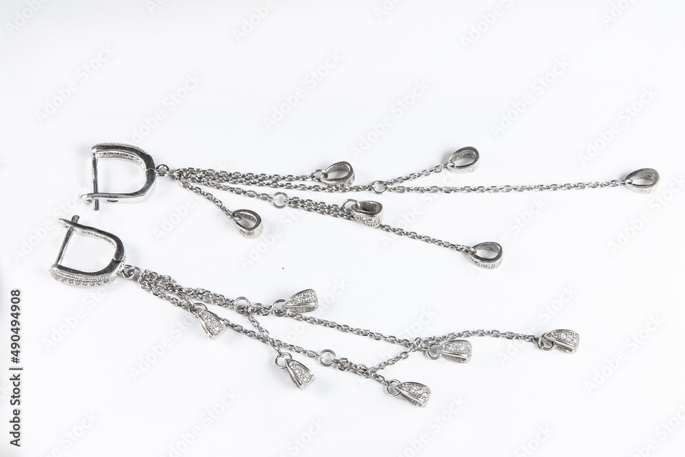 Luxury silver round earrings big jewelry for women isolated on white background, clipping path included Luxury silver round earrings big jewelry for women isolated on white background, clipping path included