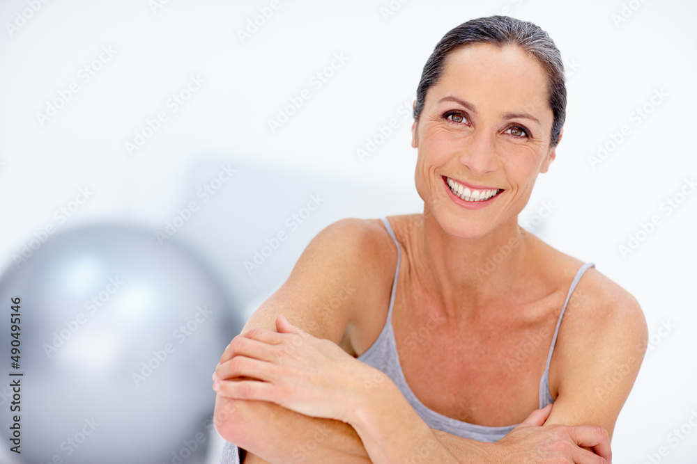 Obraz premium Staying healthy and fit. Portrait of a beautiful mature woman posing in studio.