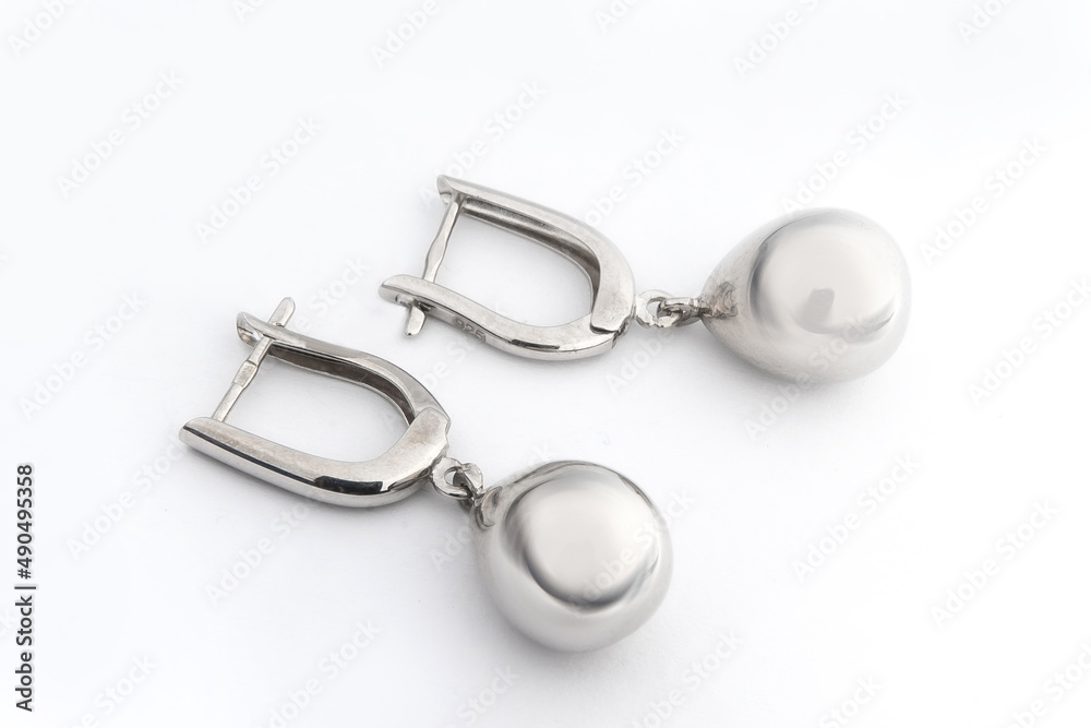 Luxury silver round earrings big jewelry for women isolated on white background, clipping path included Luxury silver round earrings big jewelry for women isolated on white background, clipping path included