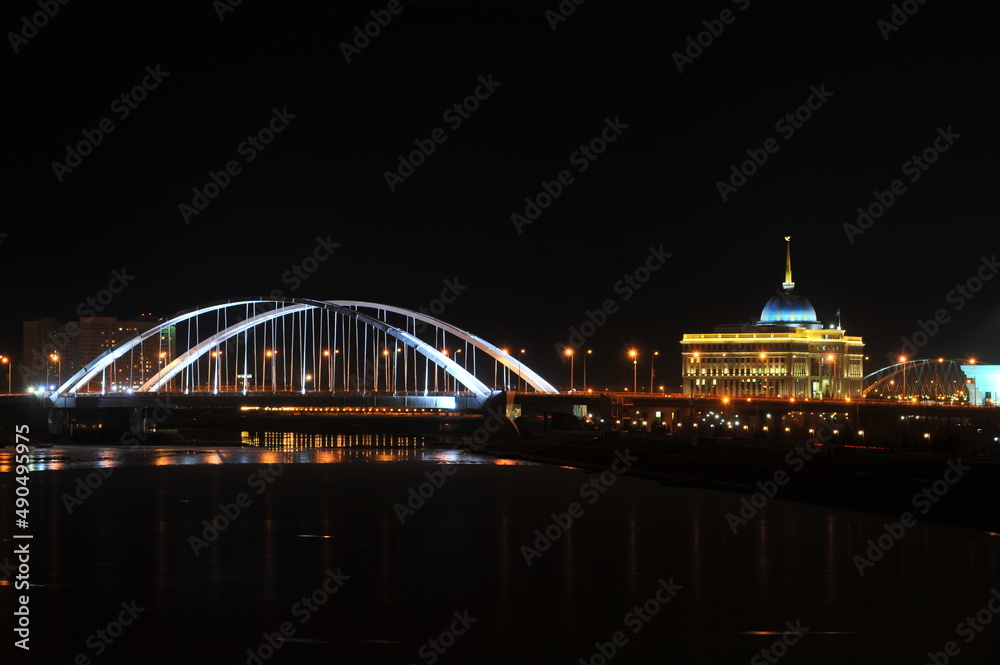 Nur-Sultan / Kazakhstan - 11.07.2011 : Night lighting of streets, bridges and the presidential administration in the Central part of the capital.