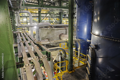 Pavlodar region, Kazakhstan - 12.10.2015 : Pipes and tanks with a centrifuge for processing sulfide ore photo