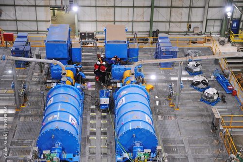 Pavlodar region, Kazakhstan - 12.10.2015 : Generators and pipes at a sulfide ore and copper processing plant photo