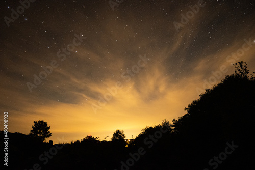 Orange night lights in the star sky long exposure photography