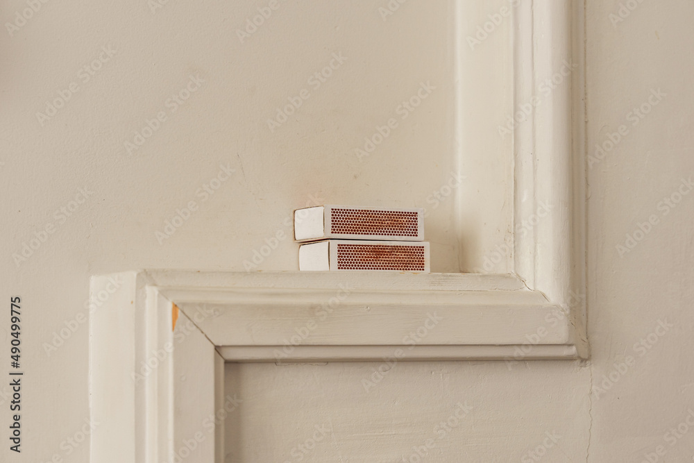 Fototapeta premium matchboxes on a mantelpiece by the stove