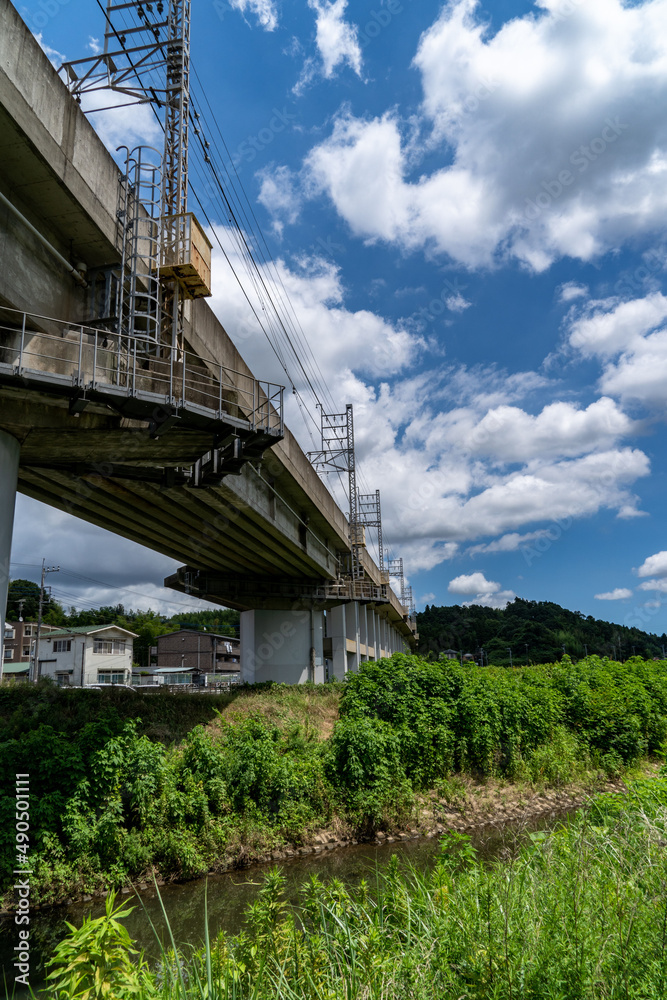 railway bridge crosses a stream in countryside, JAPAN. railway bridge crosses a stream in countryside, JAPAN.