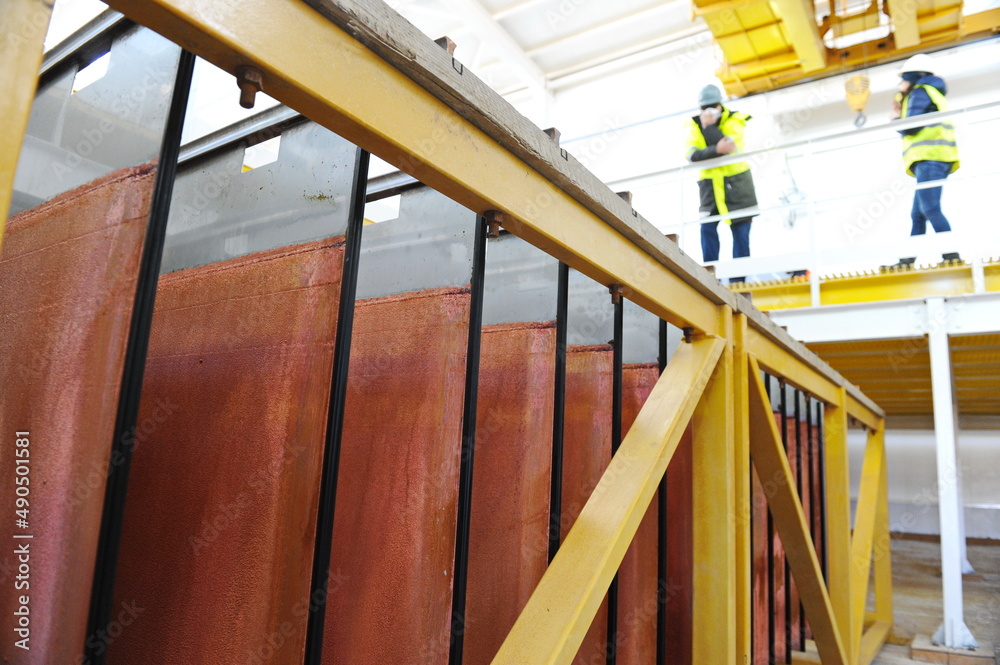 East Kazakhstan region, Kazakhstan - 12.02.2015 : Layers of cathode copper on a special lift for processing. East Kazakhstan region, Kazakhstan - 12.02.2015 : Layers of cathode copper on a special lift for processing.