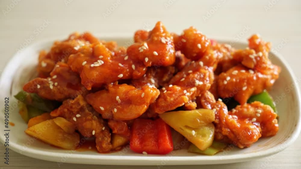 fried crispy chicken with sweet and sour sauce in Korean style fried crispy chicken with sweet and sour sauce in Korean style