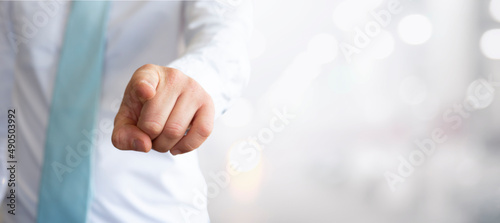 Slika na platnu businessman points his finger in our direction  - Banner design with blurred bac