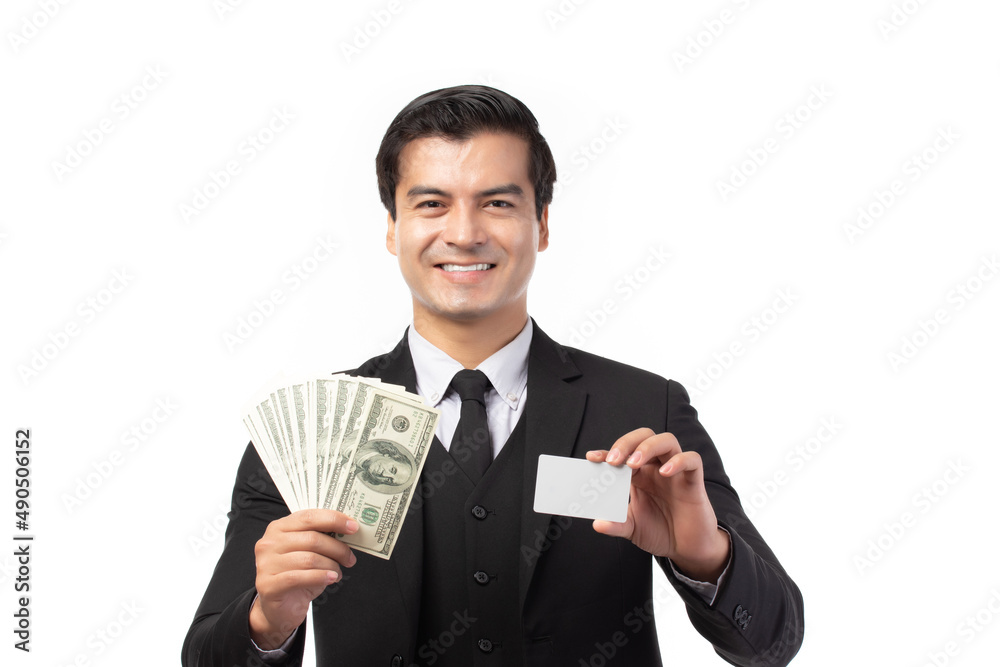 Handsome business man in black suit holding credit card and money isolated on white background. Business, technology, ecommerce and online payment concept. Handsome business man in black suit holding credit card and money isolated on white background. Business, technology, ecommerce and online payment concept.