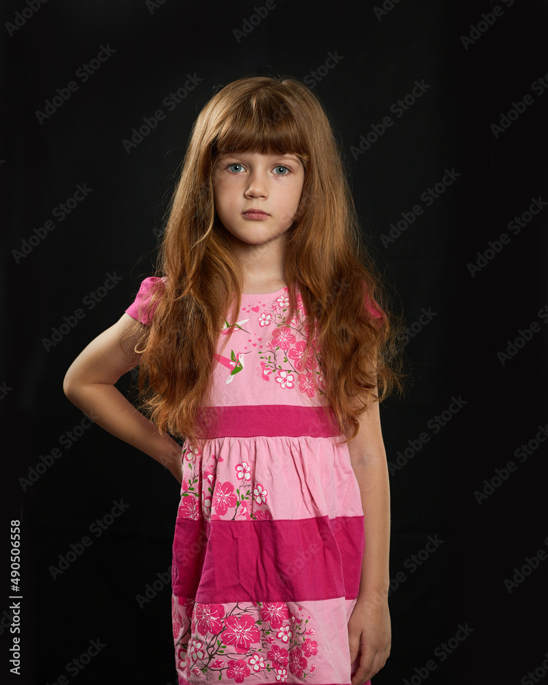 Little girl on a black background Little girl on a black background